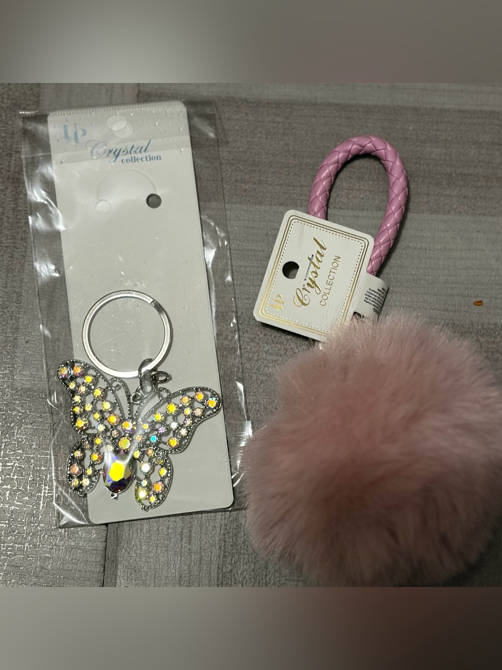 Pink Faux Fur Pom Keychain and butterfly crystal key chain. NWT